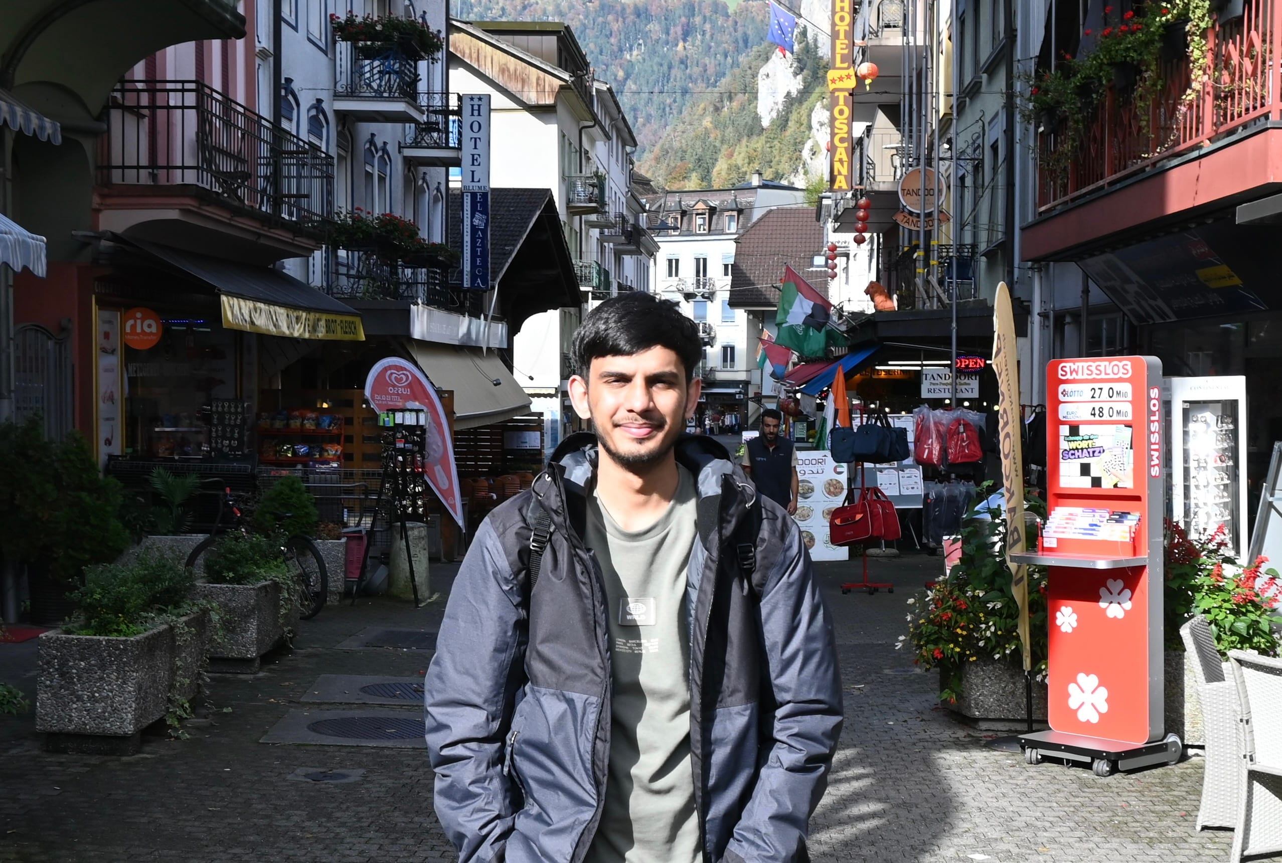 Anshul Ranjan standing on a street in Interlaken, Switzerland.